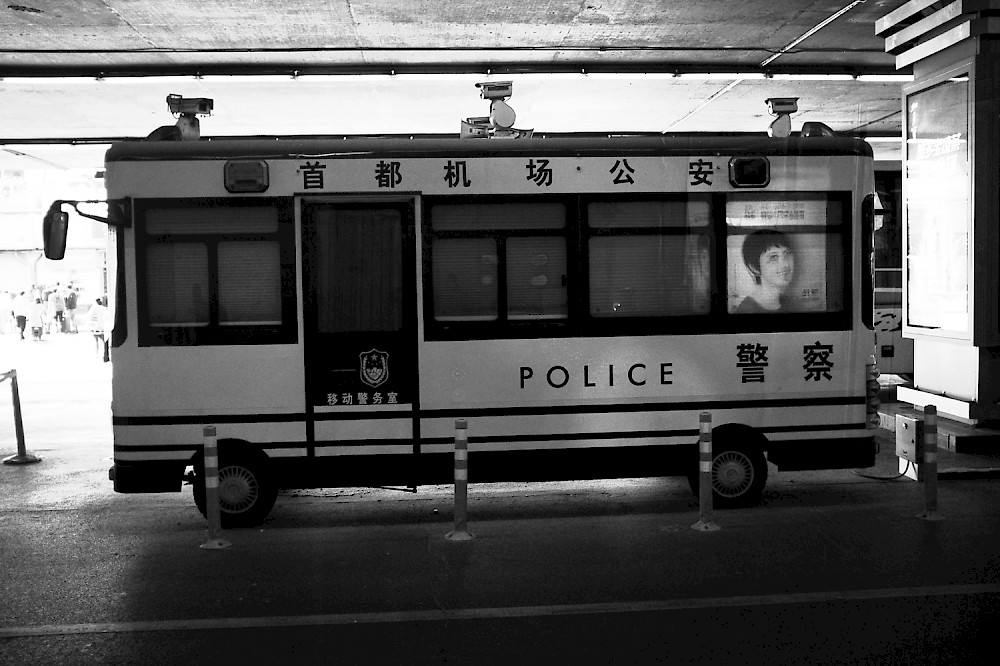 A chinese police bus on the airport