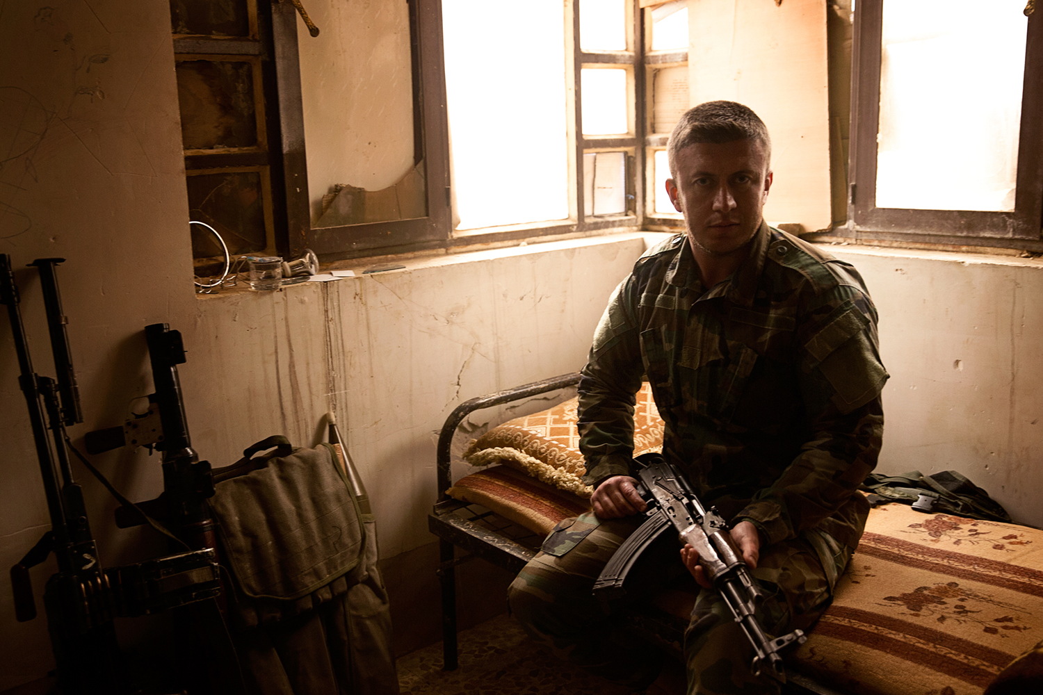 A kurdish Peshmerga Soldier on his bed