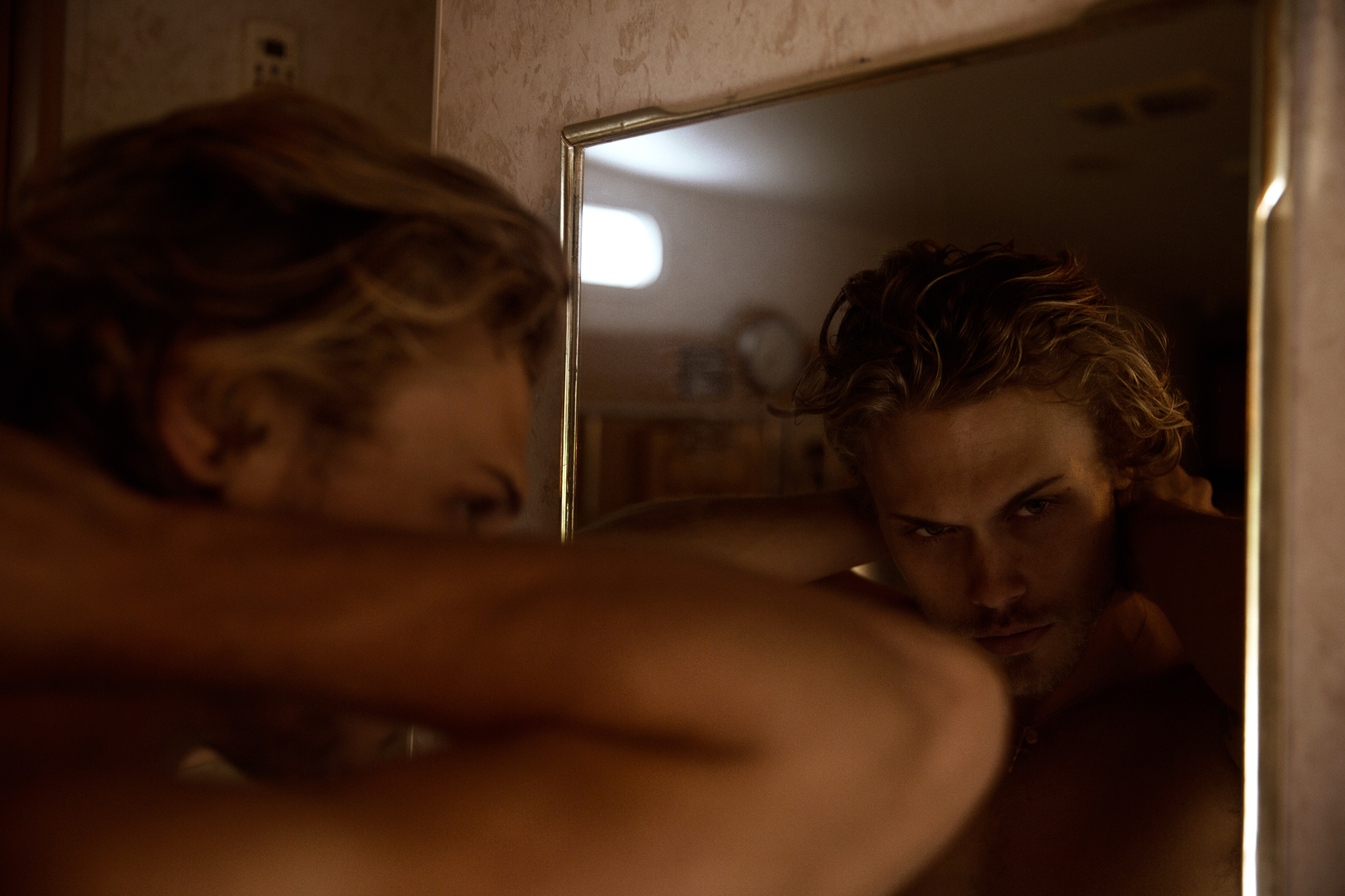 Christopher Mason looking in a mirror in a trailer in Los Angeles
